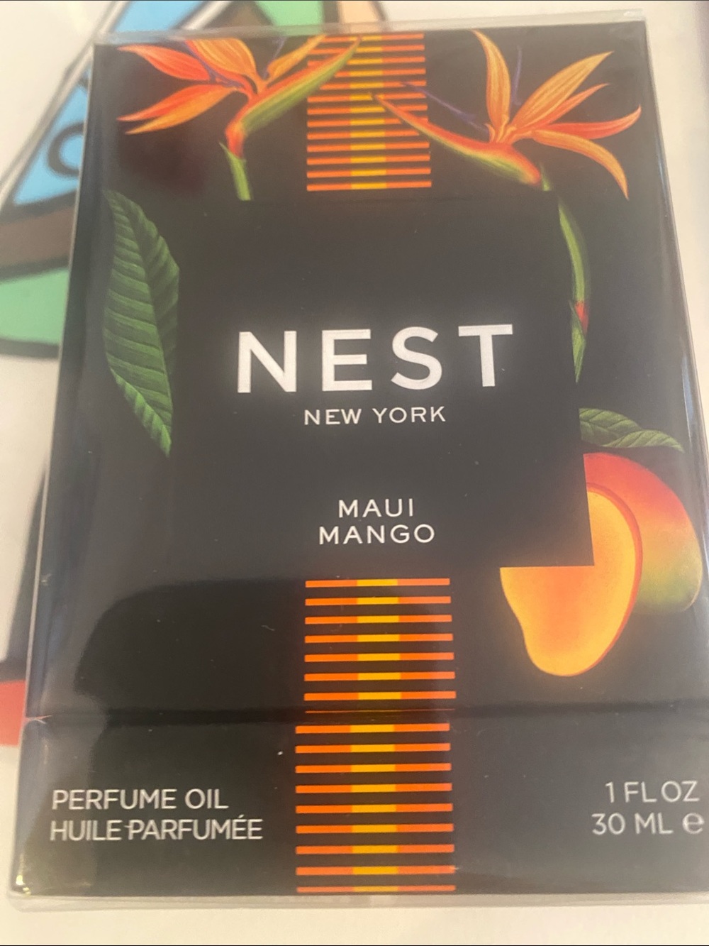 NEST Maui Mango Perfume Oil — Black and Orange Floral Packaging